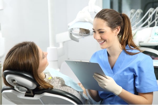 Dentist holding a Medical History